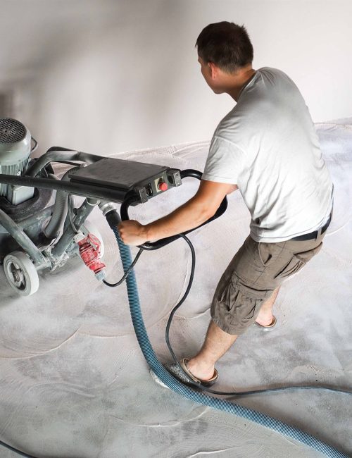 a worker doing concrete polishing floor